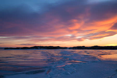 Winter landscape with color ice, sunsetの写真素材