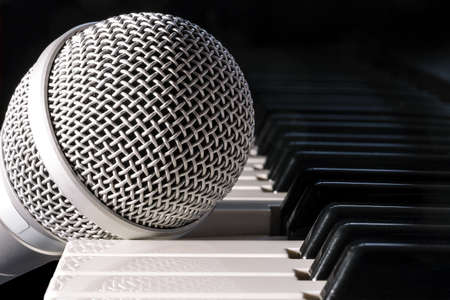 Microphone on piano keyboard, closeupの写真素材