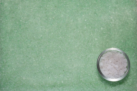Background with mint green and white sea saltの写真素材