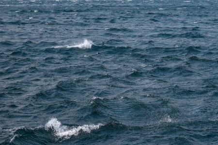 Blue wavy water texture or background, abstract