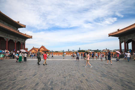 Beijing, China - August 06, 2014: Tourists visits Forbidden city. Perspective view from the old city to the modern cityのeditorial素材