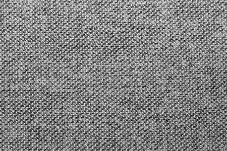 Gray and black mixed fabric texture or background, wool, tweed, melange cloth, closeupの写真素材