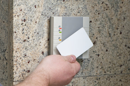 man puts the card into the reader access