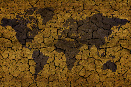 world map on cracked beige background  の写真素材
