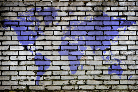 purple world map on a brick backgroundの写真素材