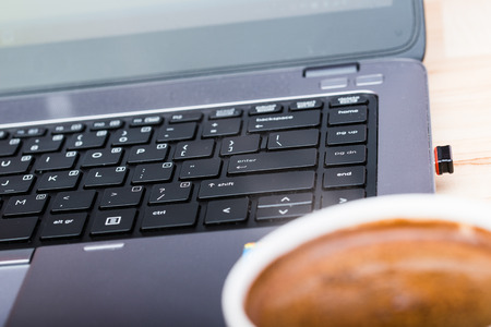 morning coffee and laptop in the backgroundの写真素材