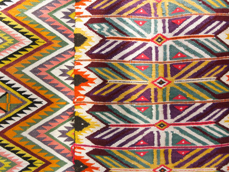 Colourful rug background divided into two sectionsの写真素材