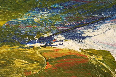 Stroke of a brush with  yellow,blue,green,white  and red paint  on a dusty metal fence - Textured abstract background-Close up 3の写真素材