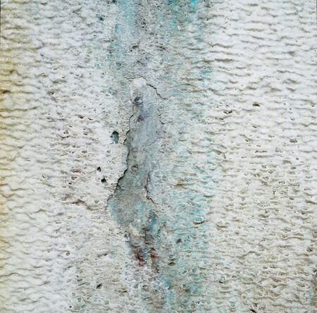 Limescale, a whitish chalky deposit on the wall caused by minerals leached from the water-Abstract background-Closeupの写真素材