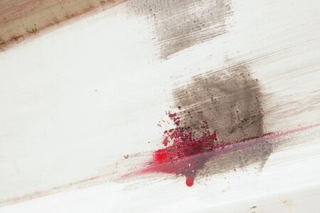 Stroke of a brush with red and brown  paint  on dusty metal fence - Abstract background-Close upの写真素材