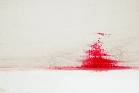 Stroke of a brush with red paint  on dusty metal fence - Monochrome abstract background-Close up