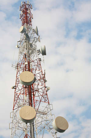 telecommunications tower with many satellite dishの写真素材
