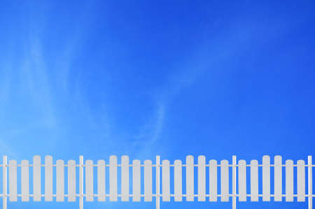 white fence and blue skyの写真素材