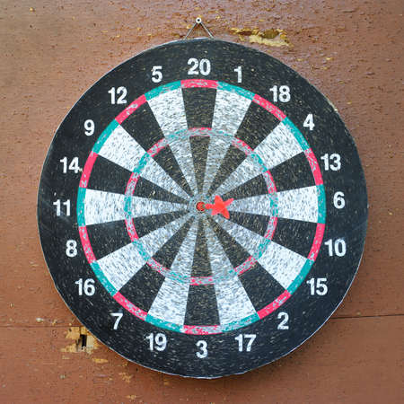 red dart hitting the targetの写真素材