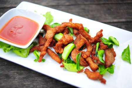 Pork fried and Kaffir lime leavesの写真素材