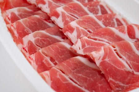 raw bacon slicesの写真素材