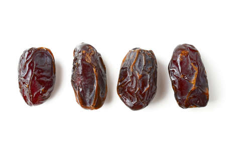 Date fruits isolated on whiteの写真素材