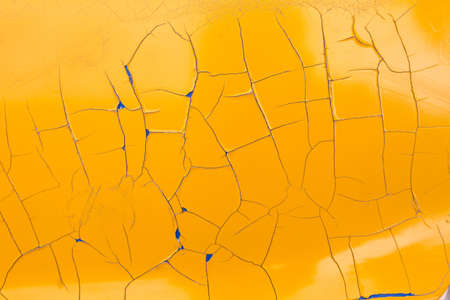 cracked peeling yellow paint texture layerの写真素材
