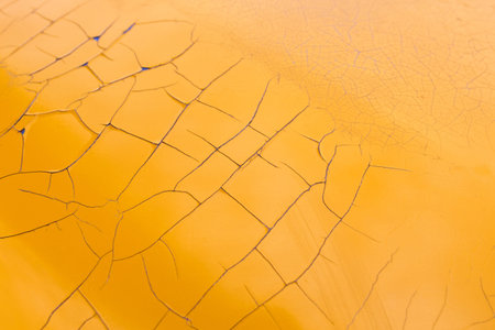 cracked peeling yellow paint texture layerの写真素材