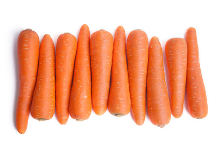 row of carrots on white background