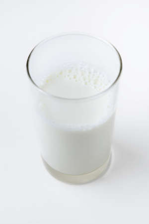 glass milk on white backgroundの写真素材