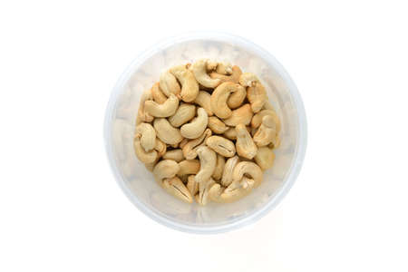 cashew nuts in plastic box, with clipping pathの写真素材