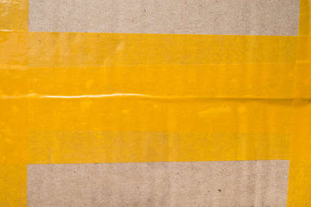 corrugated cardboard with plastic tapeの写真素材