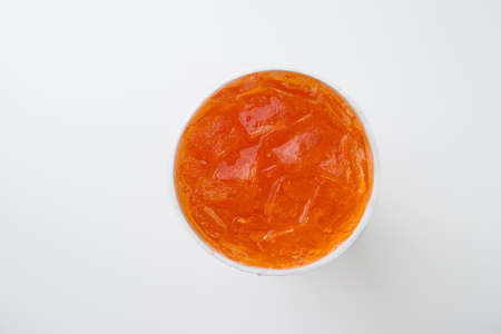 orange soda in disposable cupの写真素材