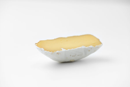cheese slice isolated on whiteの写真素材