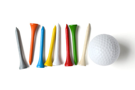 golf ball and tee on white background