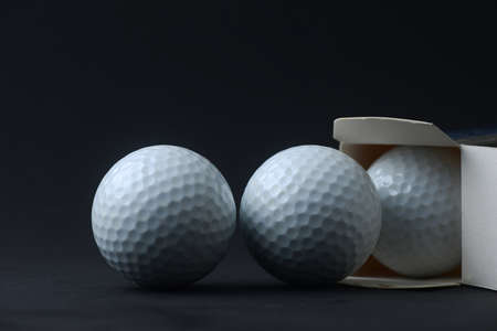 open new golf ball from boxの写真素材