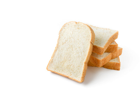 heap of sliced bread on white background