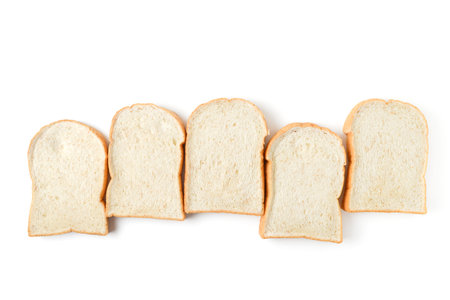 row of sliced bread on white background