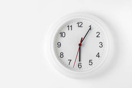clock on white wallの写真素材