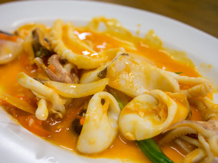 stir fried squid with salted egg yolkの写真素材