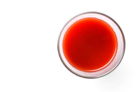 tomato juice glass isolated on whiteの写真素材