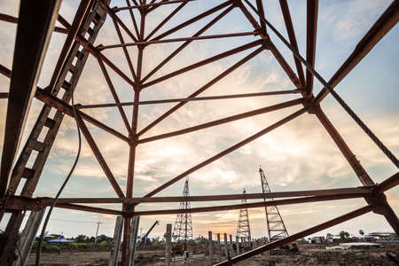 pile crane in construction site at sunsetの写真素材