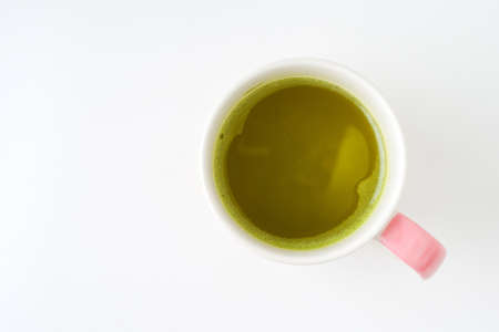 green tea cup isolated on whiteの写真素材