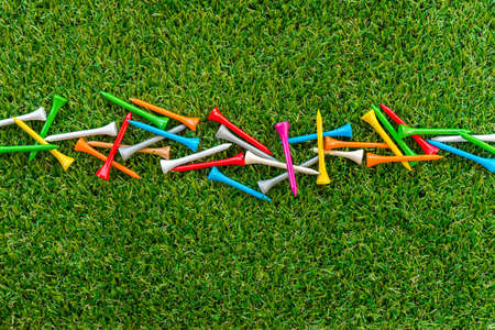 golf tee on grass in golf courseの写真素材
