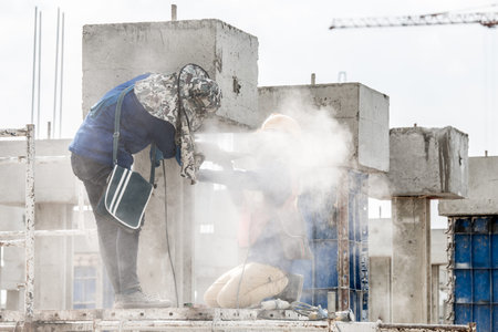 construction workers grinding in construction siteの写真素材