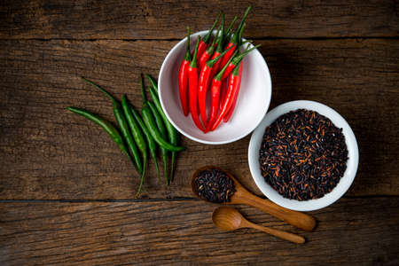 peppers with rice berry on a wooden boardの写真素材