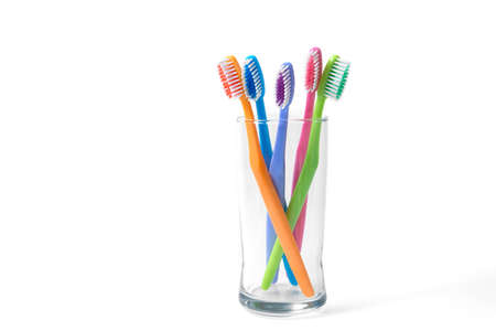 colorful toothbrushes in glassの写真素材