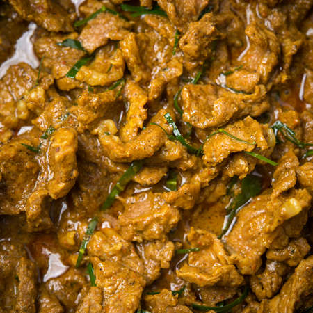 savory curry paste with beef and coconut milkの写真素材