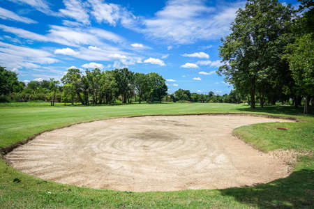 landscape of golf course with sand bunkerの写真素材