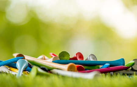 golf tees on green fieldの写真素材
