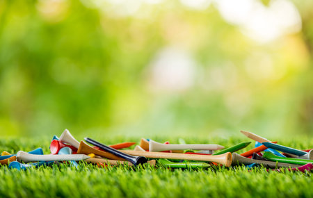 golf tees on green field