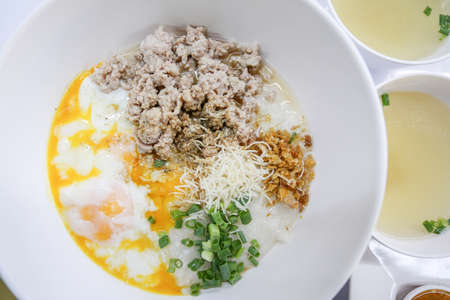 rice porridge with mince pork and soft boiled eggの写真素材