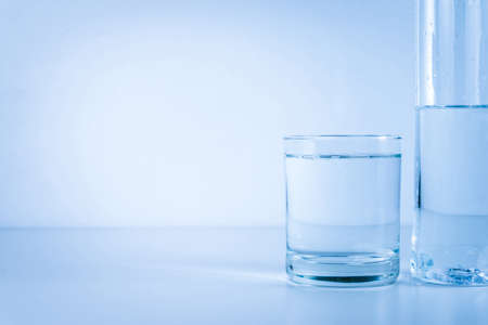 water glass with bottleの写真素材
