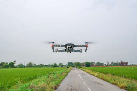 Bangkok, Thailand - May 13, 2017 : DJI Mavic Pro flying at rice field in Bangkok Thailandのeditorial素材