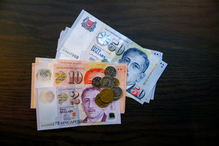 Singapore money on wooden table